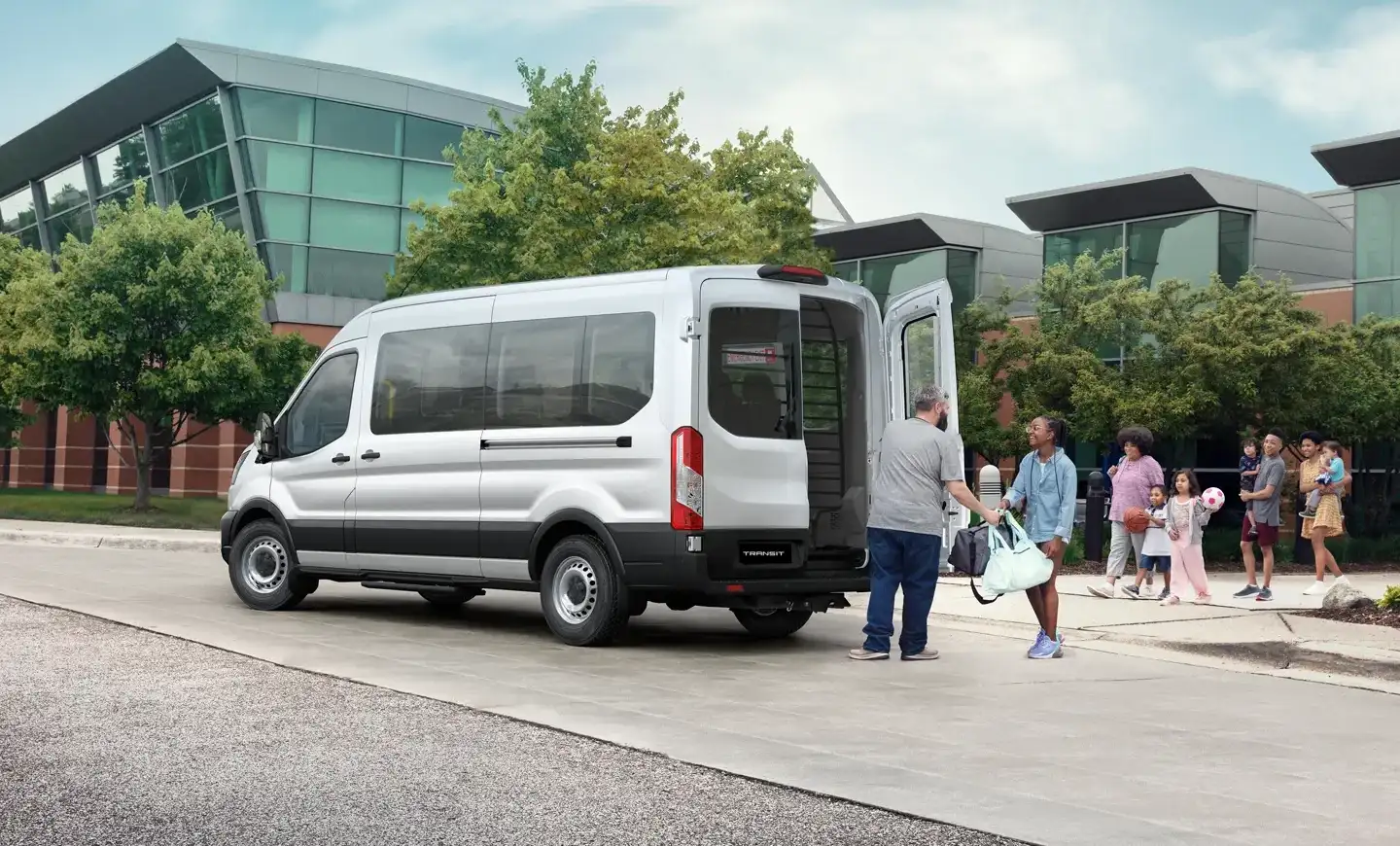 Ford Transit Bus picking up passengers