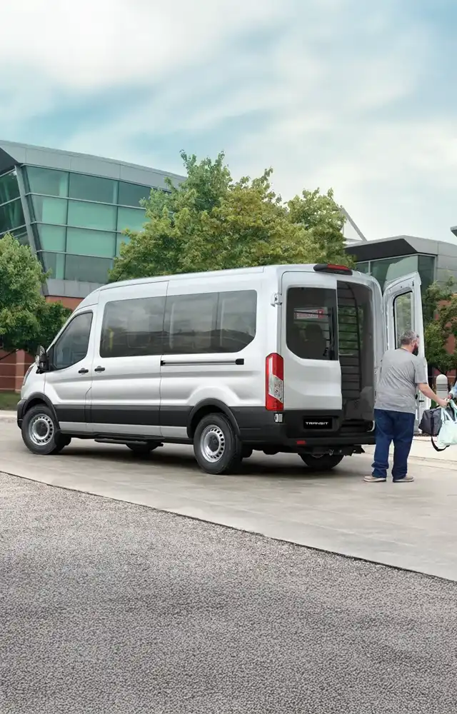 Ford Transit Bus picking up passengers