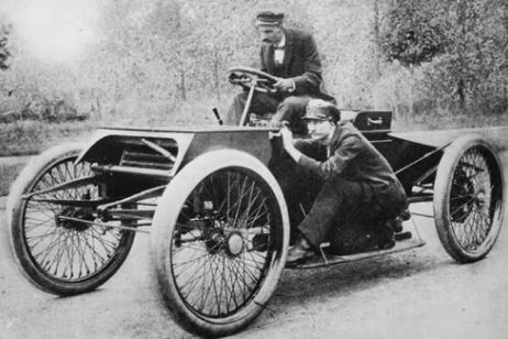 two people sitting on ford car on static