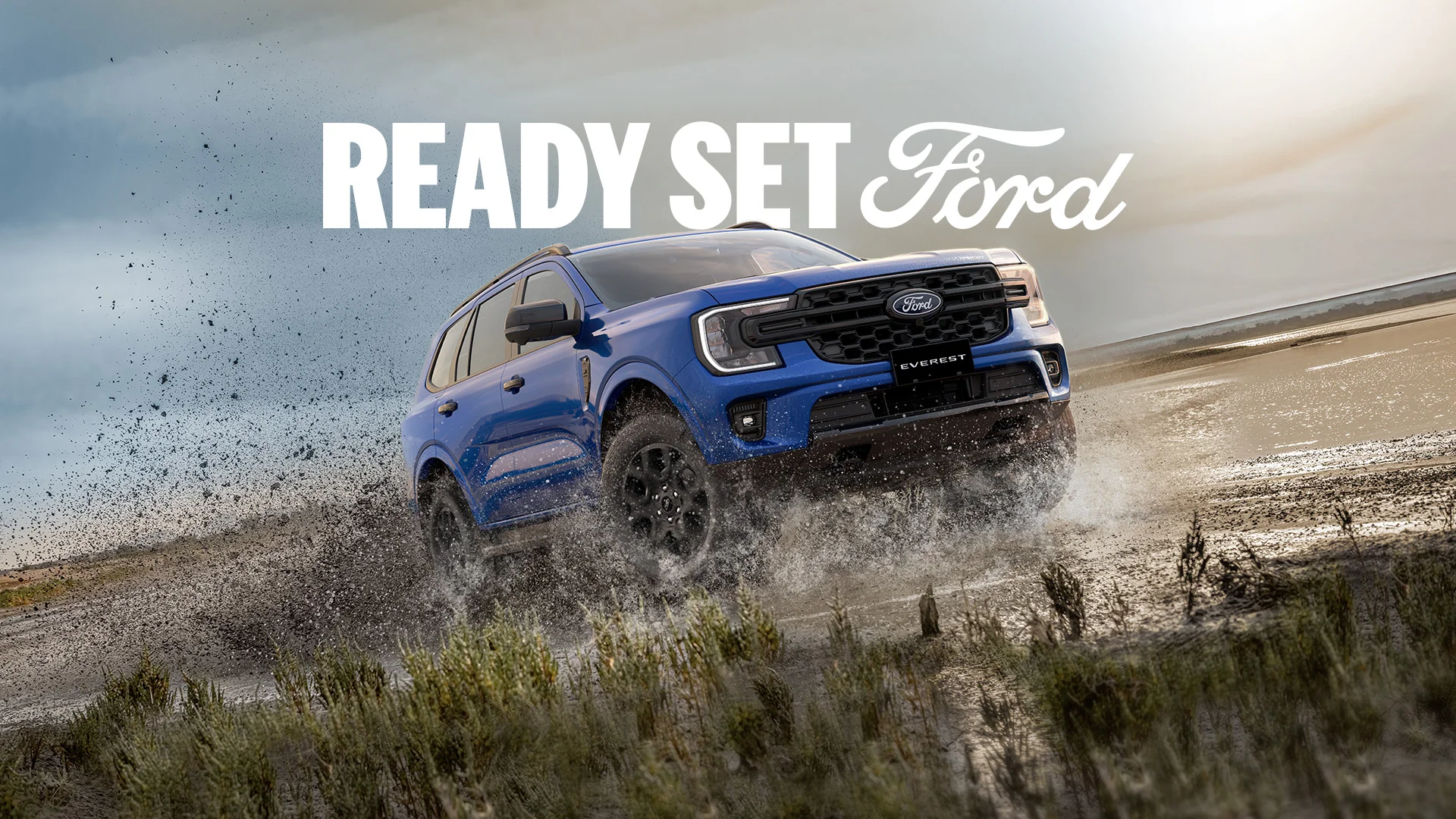 A Ford dealership with family of Ford trucks promoting the Truck Month Sales Event