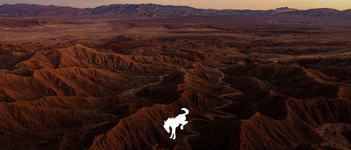 Bronco Logo with high terrain background
