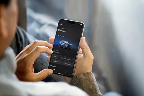 man with ford app in phone