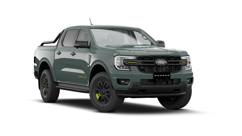 Green Ford Ranger pickup truck front three quarter view