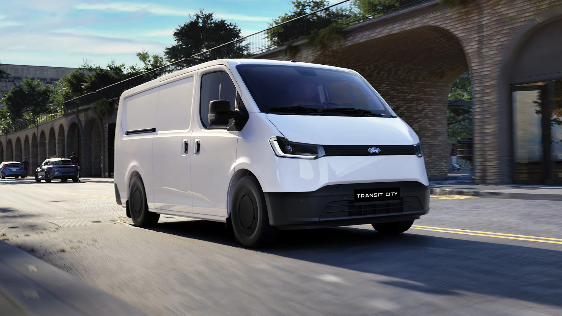 A white Ford Transit City van driving
