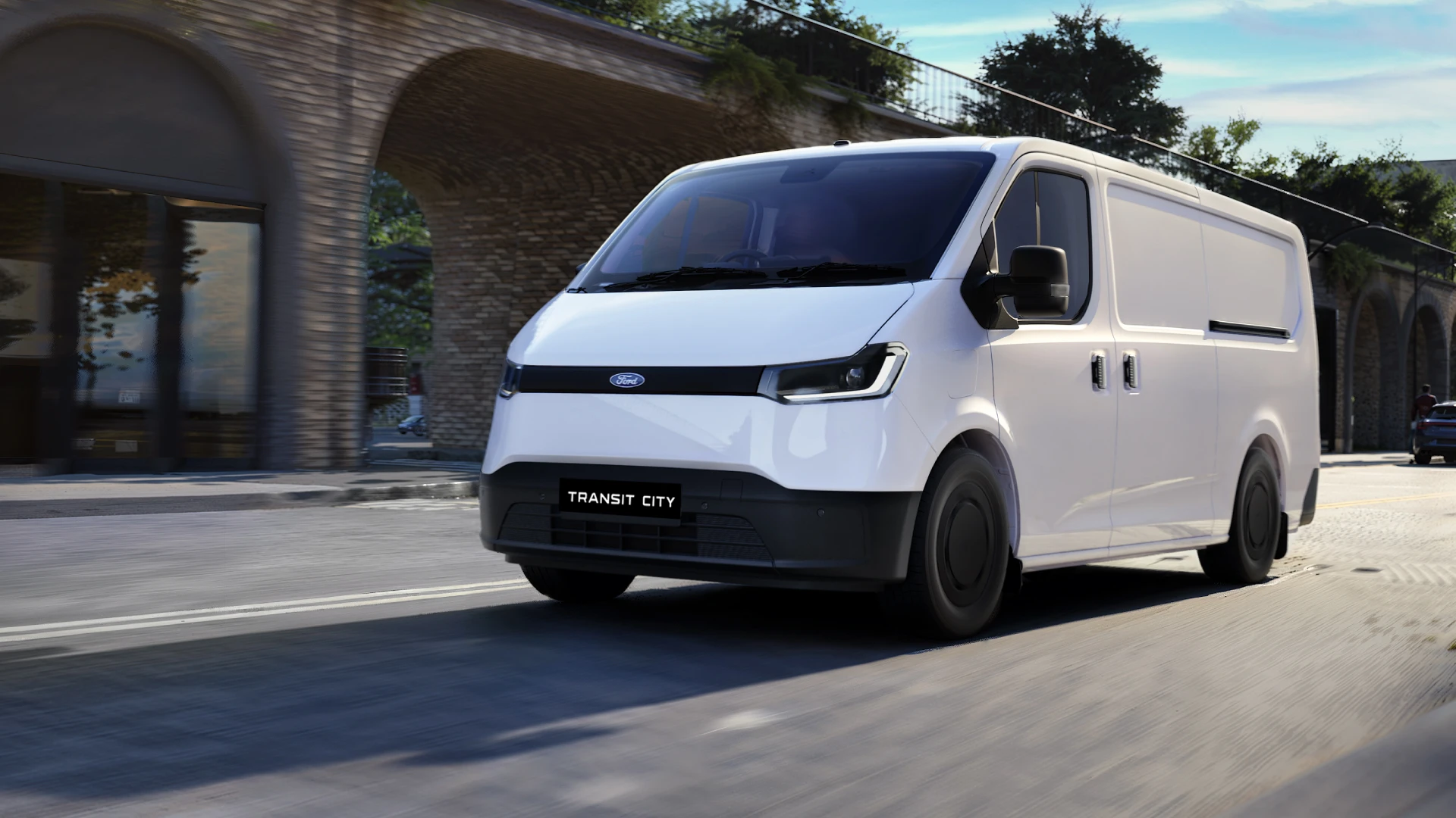 A white Ford Transit City van driving