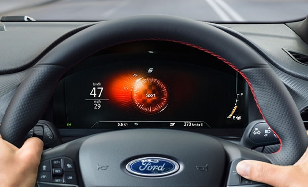 Hands on Ford Puma steering wheel showing 12.3” Digital Instrument Cluster